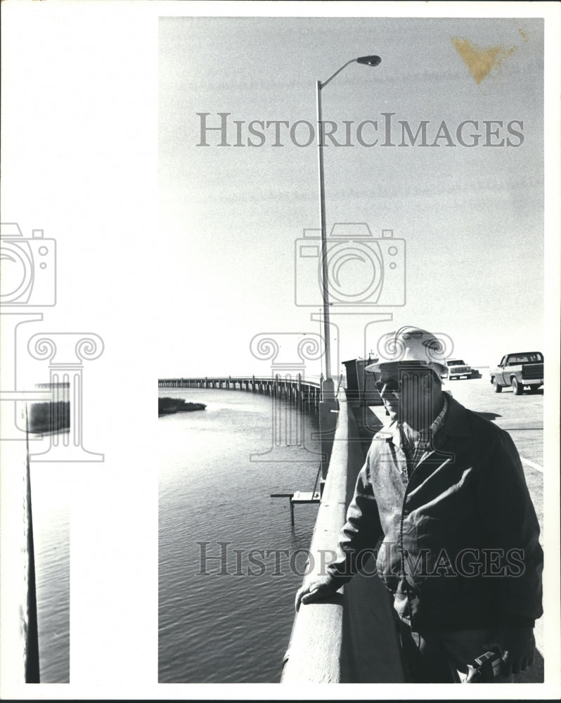 1989, Man with Hardhat near body of water at Naval Station Company - Historic Images