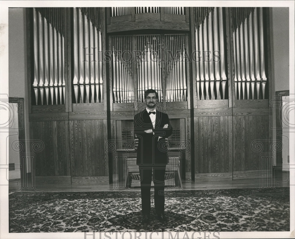 1987 Jim Cook, organist in front of pipe organ - Historic Images