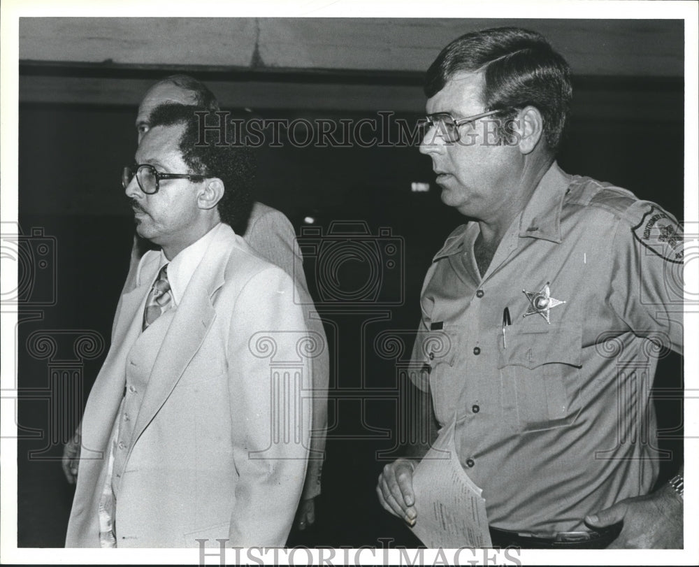 1982 Deputy Andy Cooper with others in hallway - Historic Images