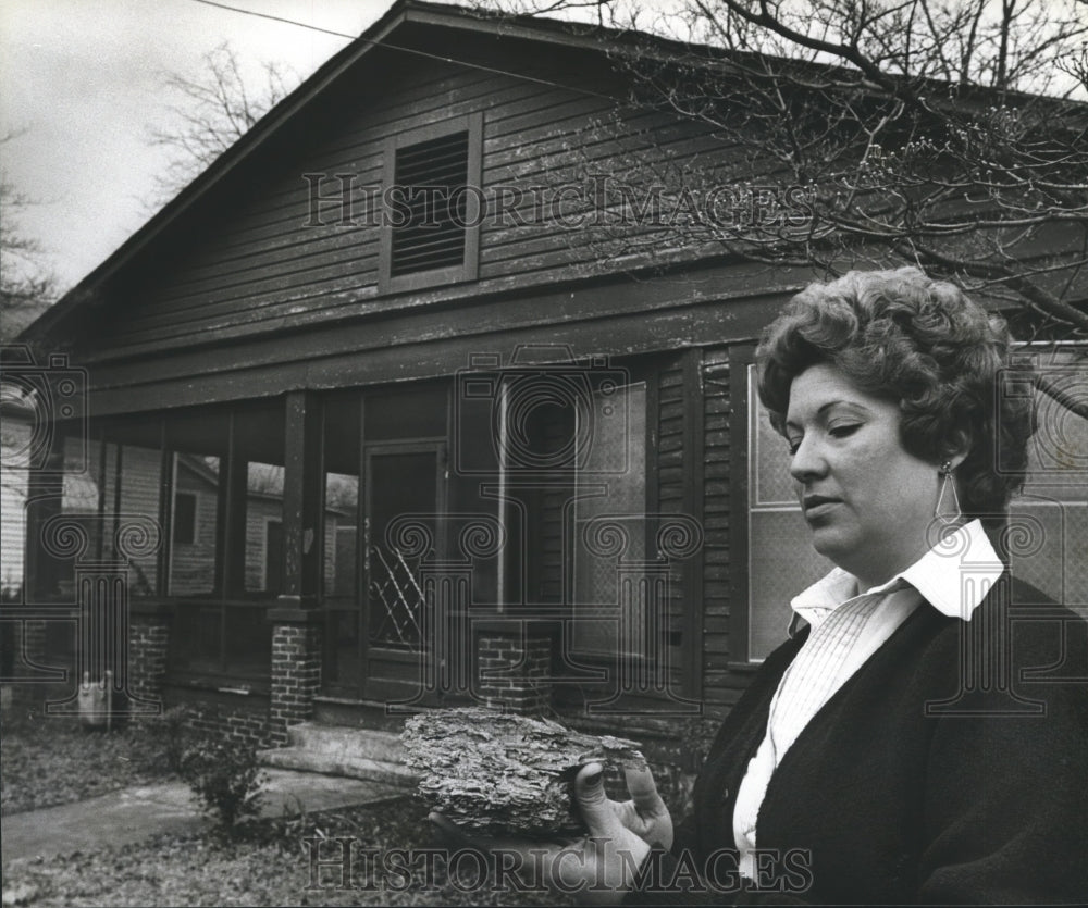 1979, Doris Contine Holding Termite-Infested Wood From House - Historic Images