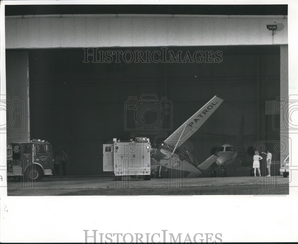 1988, Storm winds tip a Cessna 180 up on one wing, Birmingham - Historic Images