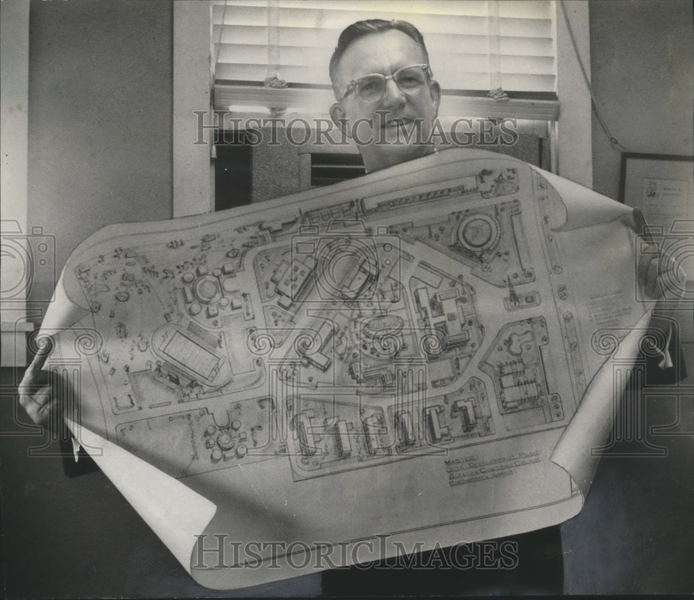 1962, Dr. Rex Turner holds blueprint for Alabama Christian College - Historic Images