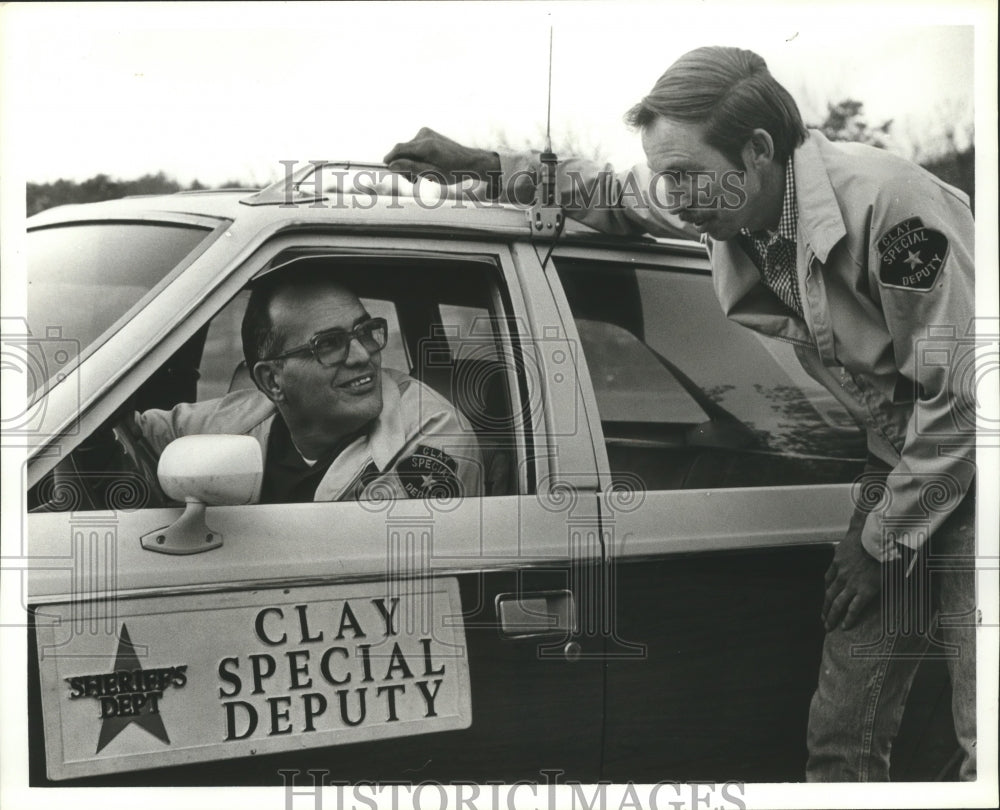 1979 Special Deputy Howard Kohser in Clay Sheriffs Dept. patrol car - Historic Images