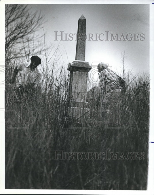 1982 Thomas Wooden and Robert Wills clean up Cemetery weeds - Historic Images