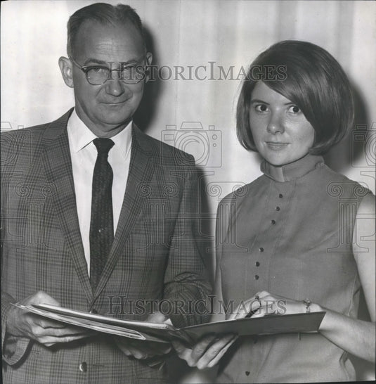 1969, John Finley, Junior, faculty chairman and Miss Smith with Book - Historic Images