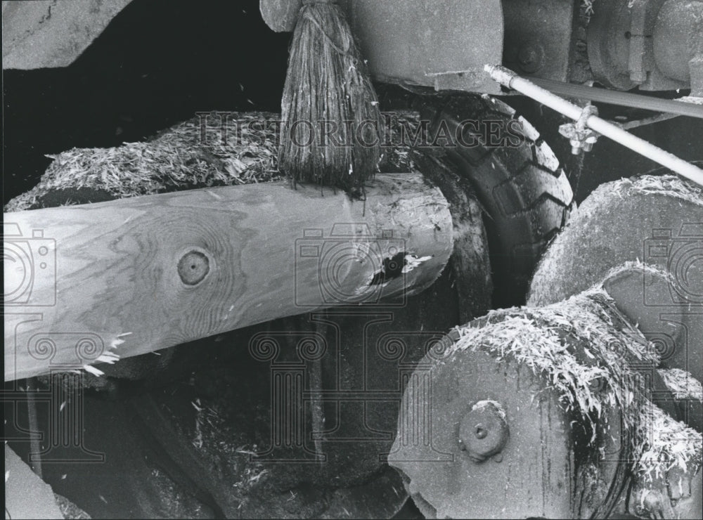 1978 Machine stripping bark from logs at Koppers in Elmore County - Historic Images