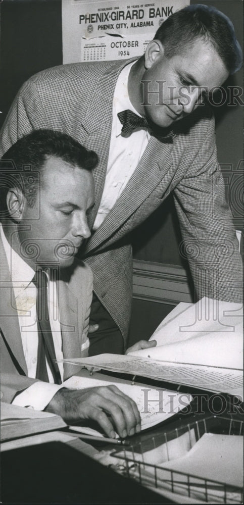 1954 Conrad Fowler and Bernard Sykes check papers for court order - Historic Images