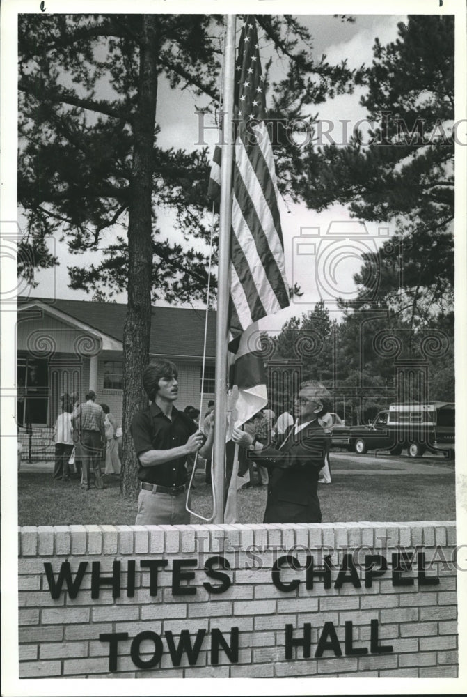 1981, Mayor Chris Fowler and James H. McClendon raise Old Glory - Historic Images