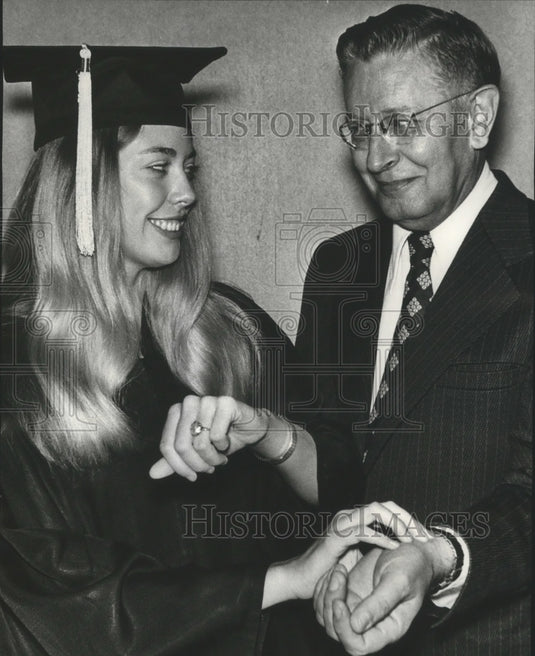 1974, Samford graduate Ginger Dobbins shakes father's hand - Historic Images