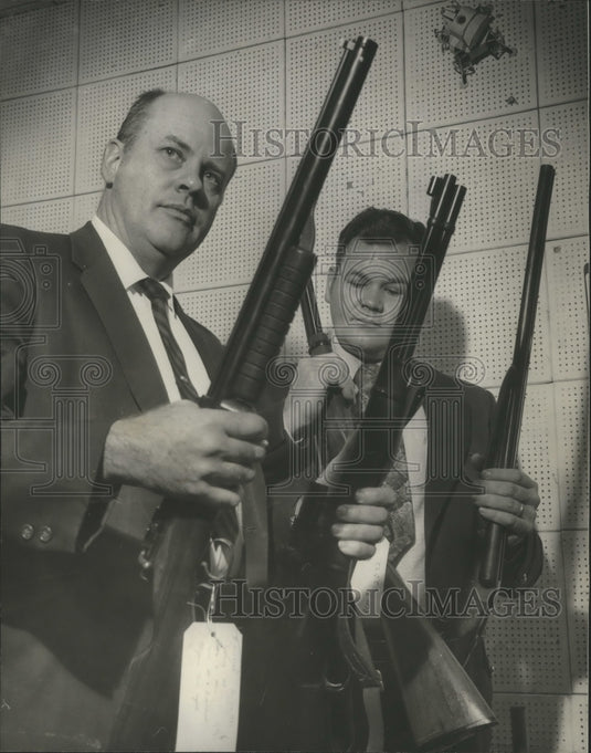 1971, Birmingham Sergeant O. C. Ellard and Lt. Chilcoat hold guns - Historic Images