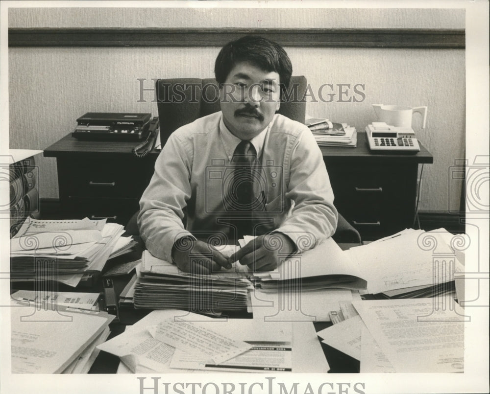 1989 District Judge George Craig at desk with papers - Historic Images