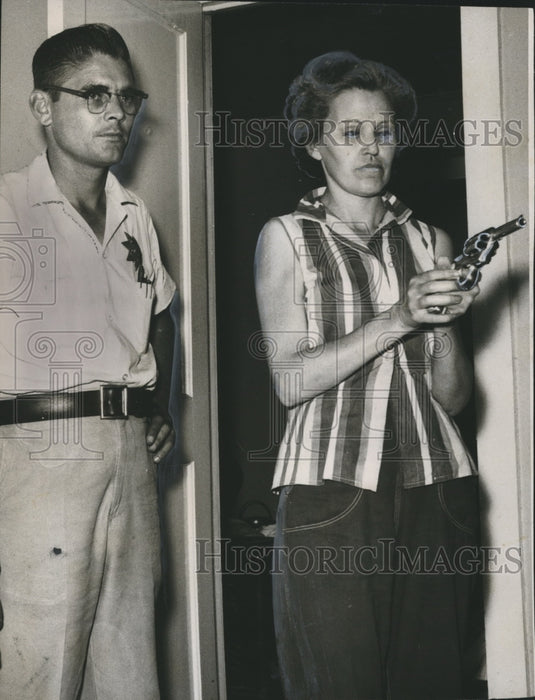 1958, Mrs. Lowwell Harville demonstrates wiht gun in Sylacauga - Historic Images