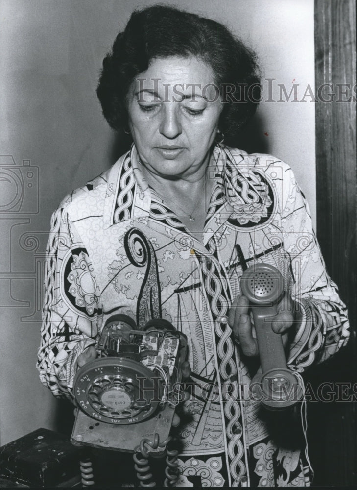 1978 Mrs. Babakitis Examines Vandalized Telephone, Alabama - Historic Images