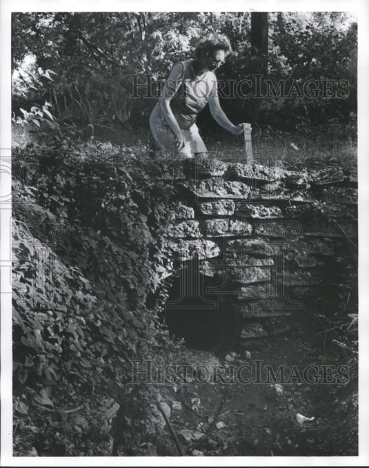 1977 Mrs. O'Herron in Birmingham, Alabama Ditch with pipe marker - Historic Images