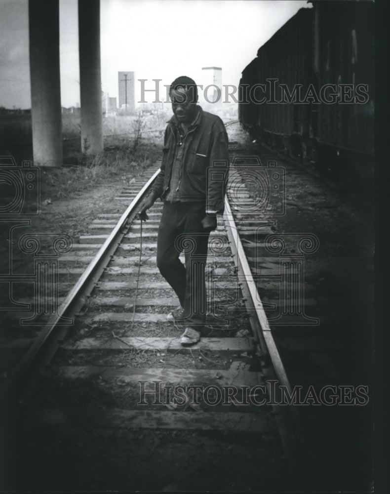 1976, Fred Warren lives under viaduct, walks on Railroad tracks - Historic Images