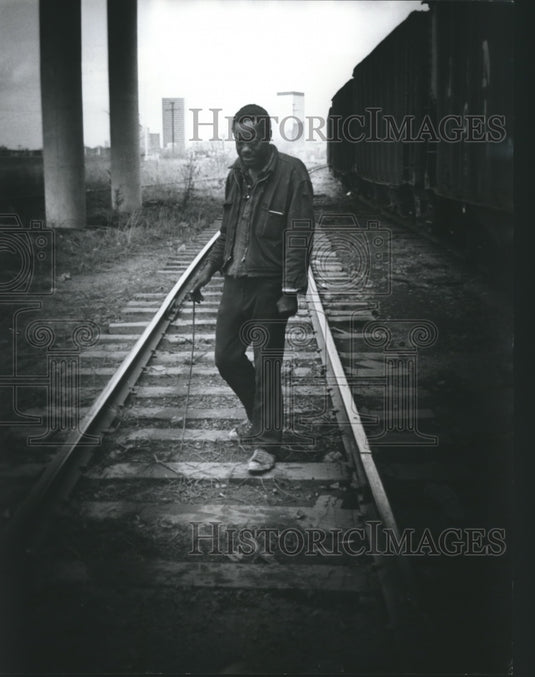 1976, Fred Warren lives under viaduct, walks on Railroad tracks - Historic Images