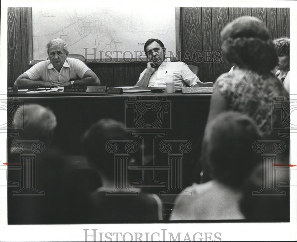 1980, Calera Mayor George Roy and Councilman Terry G. Snow listen - Historic Images