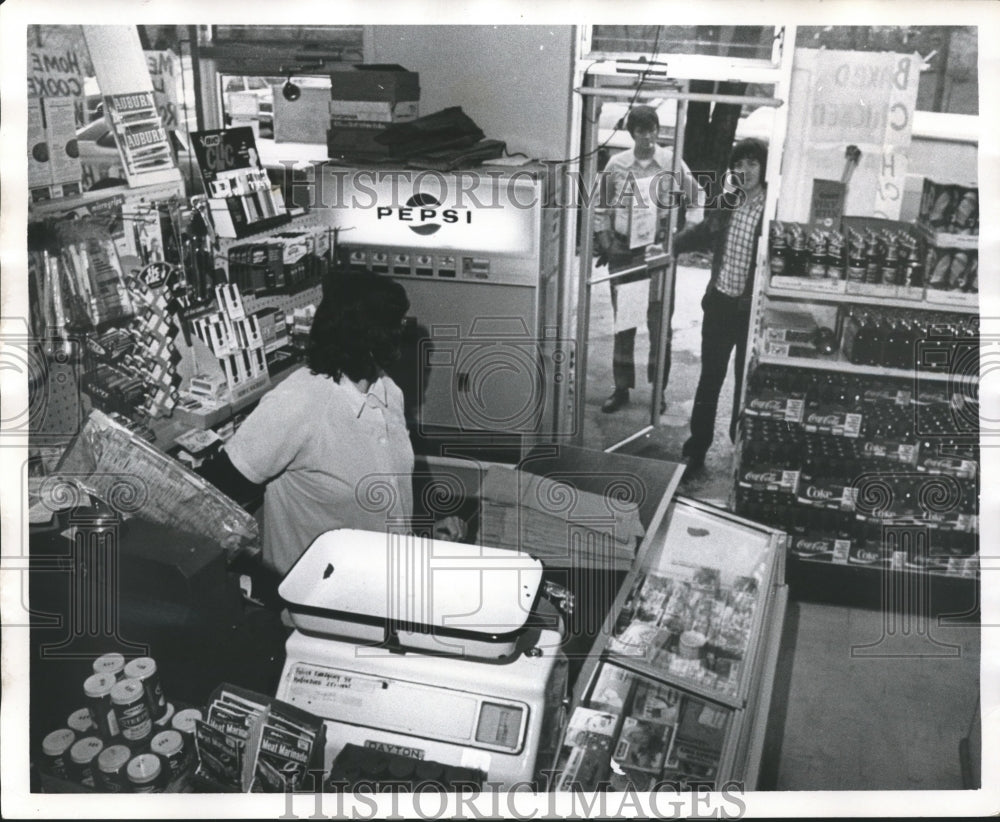 1975, Unidentified persons entering store in Birmingham, Alabama - Historic Images