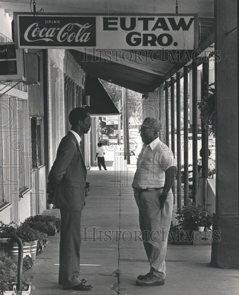 1983 Rev. Thomas Gilmore chats with parishioner Luther "Kitty" Means - Historic Images