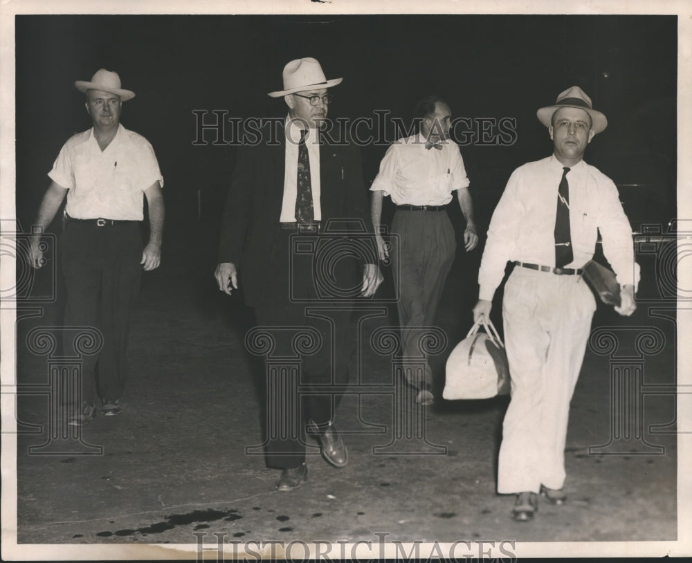 1954, B. M. Dinken, Wilton Hogan and Arch Ferrell Russell walking - Historic Images