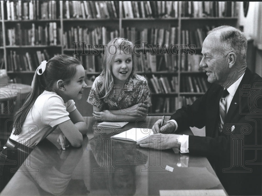 1982, Roy Gilbert autographing books for school students, Alabama - Historic Images