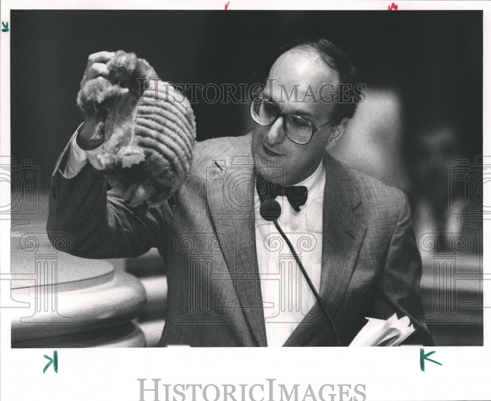 1991, Representative Bill Fuller holding an armadillo - abna31517 - Historic Images