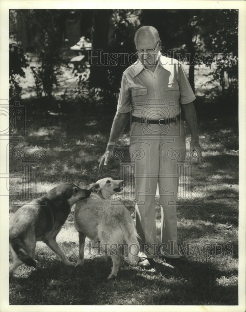 1979, James W. Hunter with his dogs was mercury poisoning victim - Historic Images