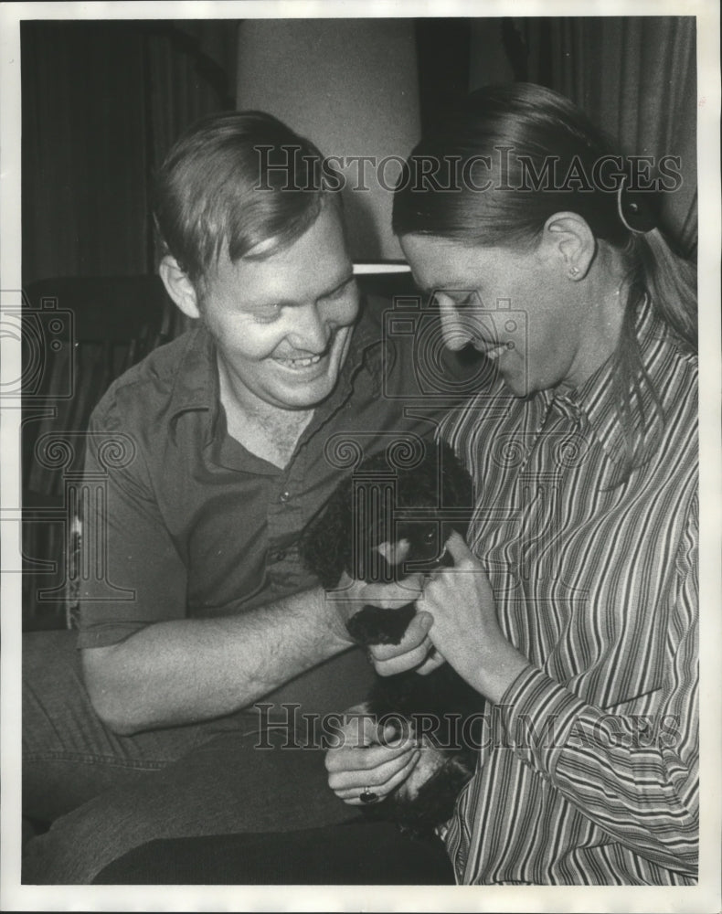 1972, Birmingham Police officer with puppy and unidentified lady - Historic Images