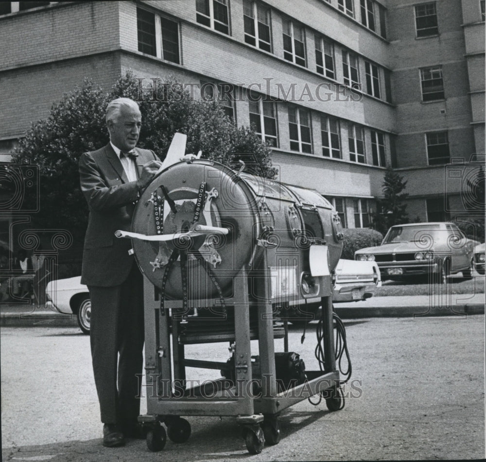 1969, John Howell, Children's Hospital Administrator, with Iron Lung - Historic Images