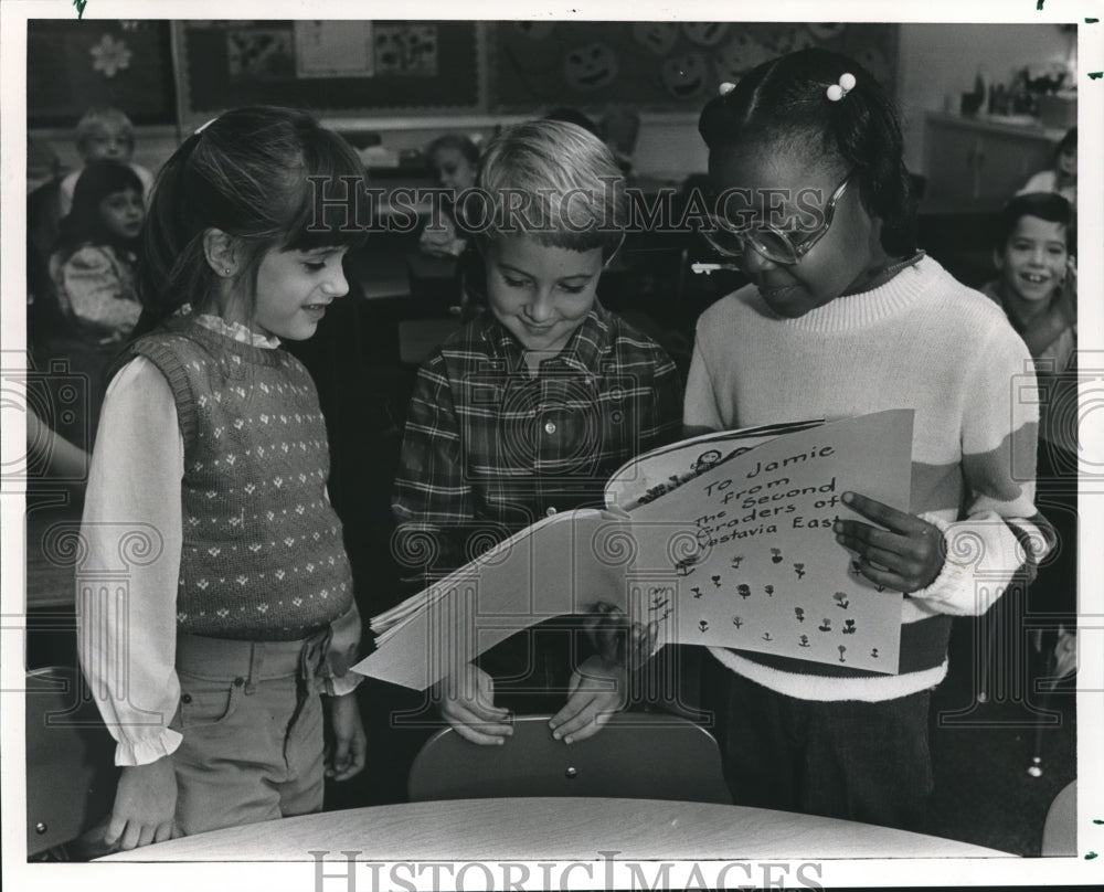 1985, Jennifer Roby, Scott Magargee and Jamie Jenkins with Book - Historic Images