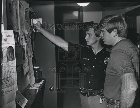 1985, Chief J. K. Maddox and Sergeant Jimmy Higgins check chart - Historic Images