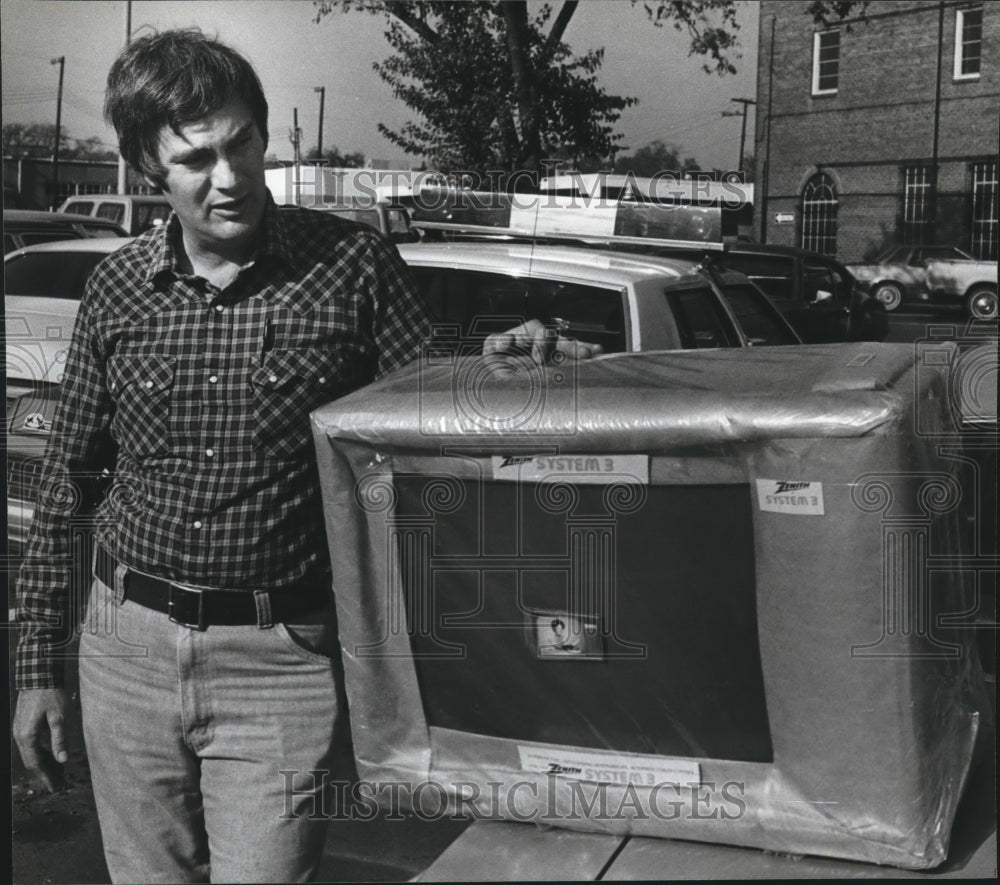 1981 Sergeant Richard Hutchcraft with confiscated television - Historic Images