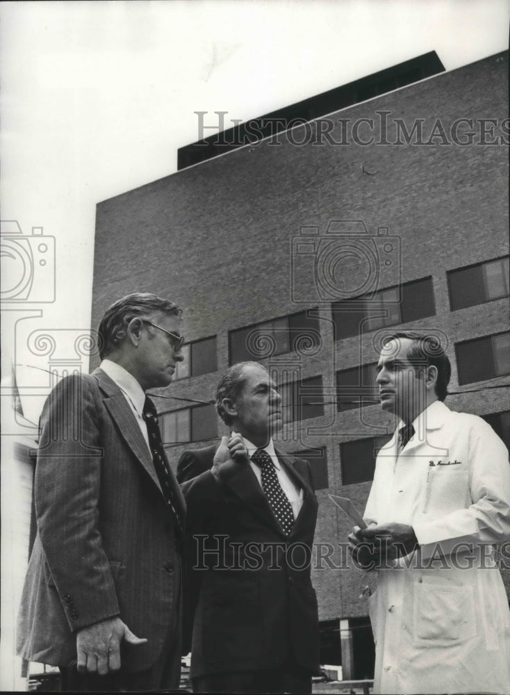 1977, Robert A. McDowell and Marvin Terrell give money to Hospital - Historic Images