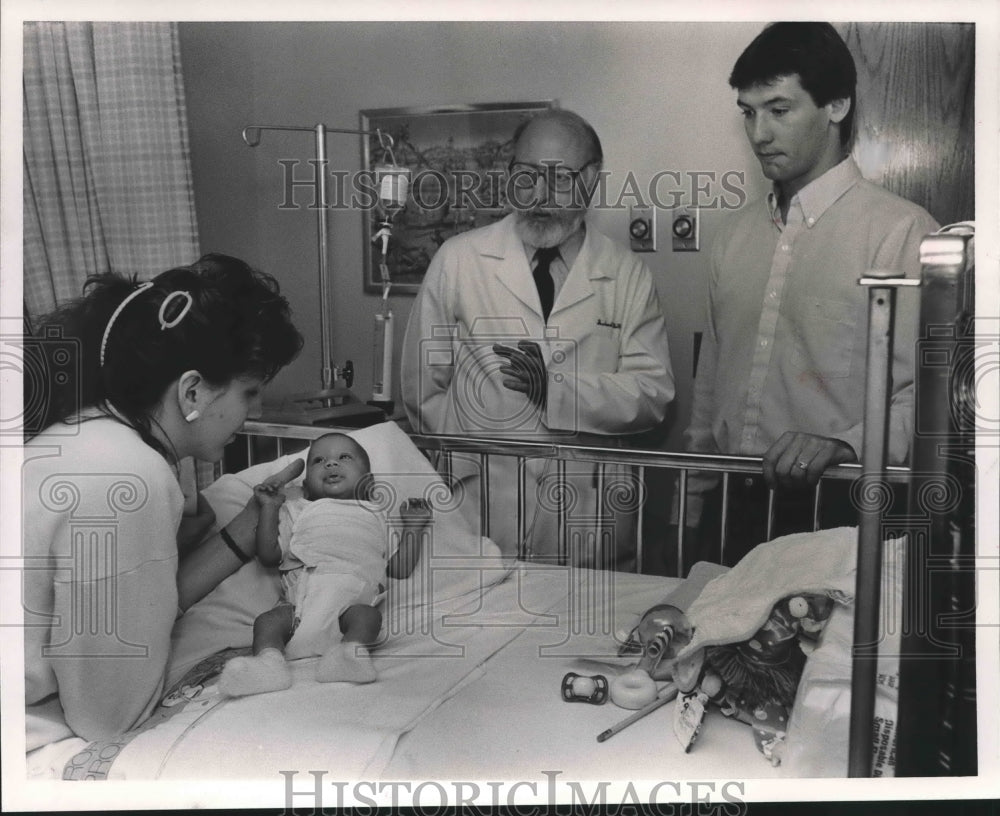 1987, Ashley Jacobs, Patient with Mother Mary and father Tom, Doctor - Historic Images