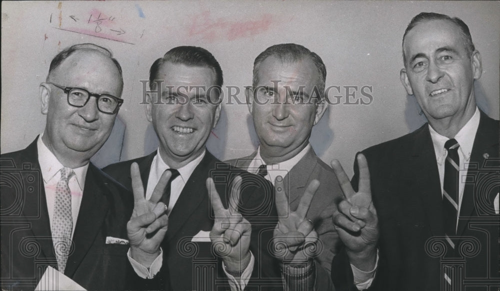 1965 Press Photo Jubilant Councilman display victory sign at sign rally - Historic Images