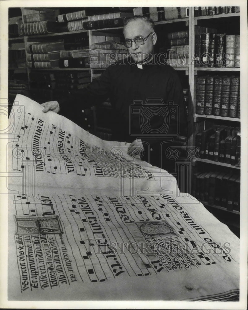 1978 Reverend Roger Lott, Southern Benedictine, with manuscript - Historic Images