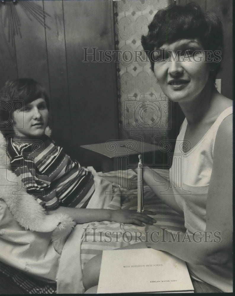 1975, Paralyzed Kirklan Hart, Mrs. Hart put away diploma - abna34794 - Historic Images