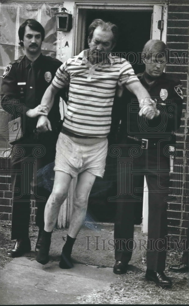 1981, Kenneth Harris is led from basement apartment by Police, Crime - Historic Images