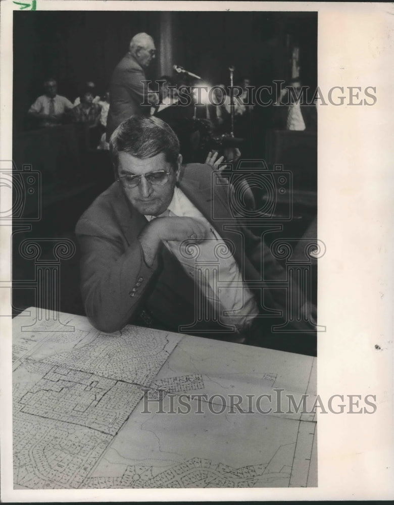 1987 Representative Billy Gray looking at area maps, Alabama - Historic Images