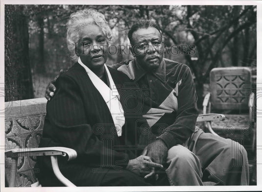 1990, Henry and Johnnie Lee Harris sit on bench in back yard - Historic Images