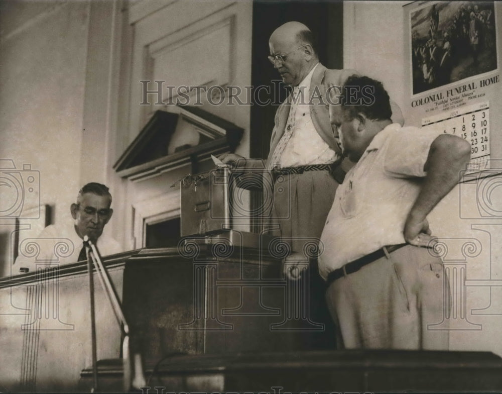 1954, Judge Walter Jones reads names inside Russell County courtroom - Historic Images