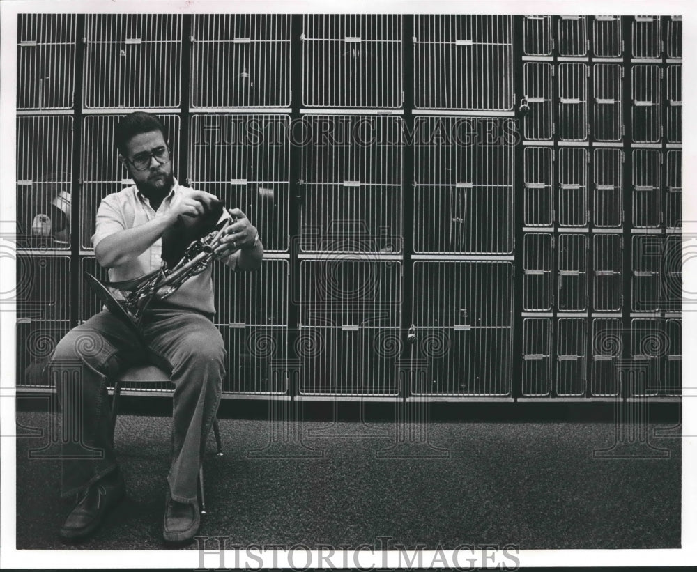 1985 Mike Jones polishes instruments at Hewitt-Trussville School - Historic Images