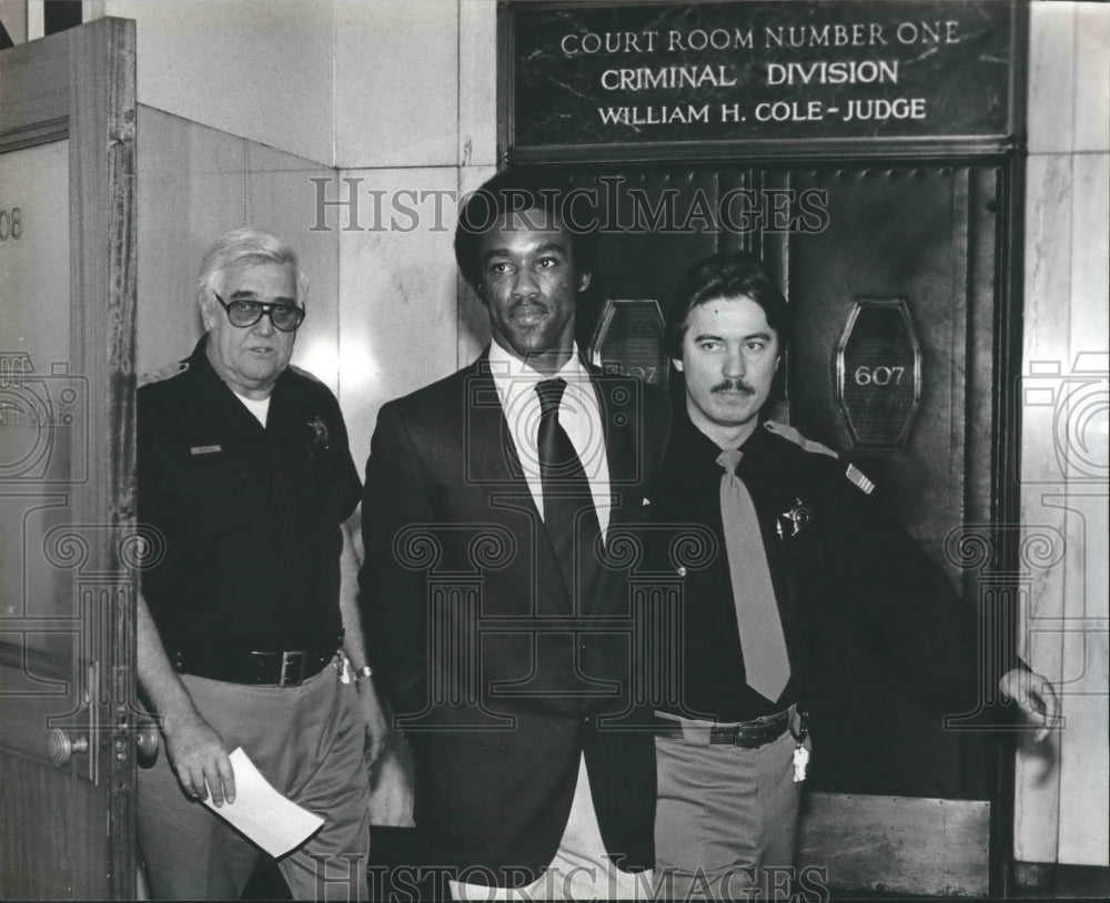 1983, Bennie Ray Jones escorted from courtroom after trial, Alabama - Historic Images