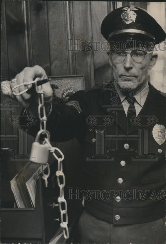 1967, Birmingham Police Officer J. E. McDonald with lock and chain - Historic Images
