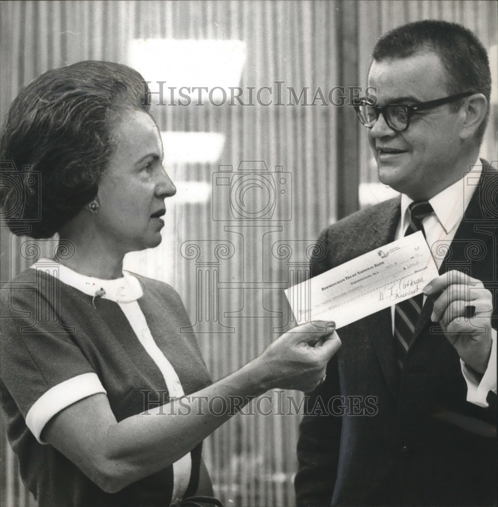 1965, Mrs. William C. McDonald Jr. with Cassell Stewart from Bank - Historic Images