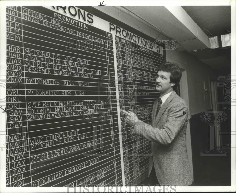1982, Bill Lee, P. R. for Birmingham Barons, Lee checks out schedule - Historic Images