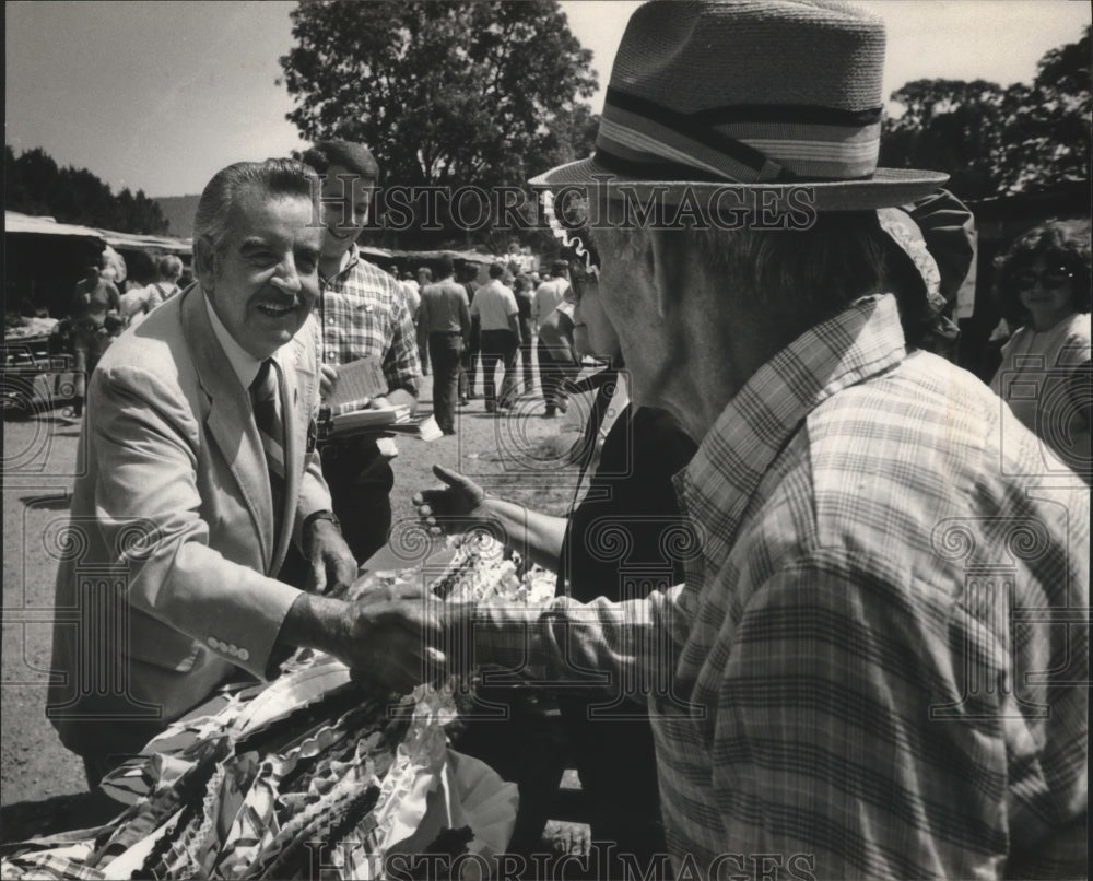 1982, Joe McCorquodale, Politician, shakes hands with supporter, AL - Historic Images