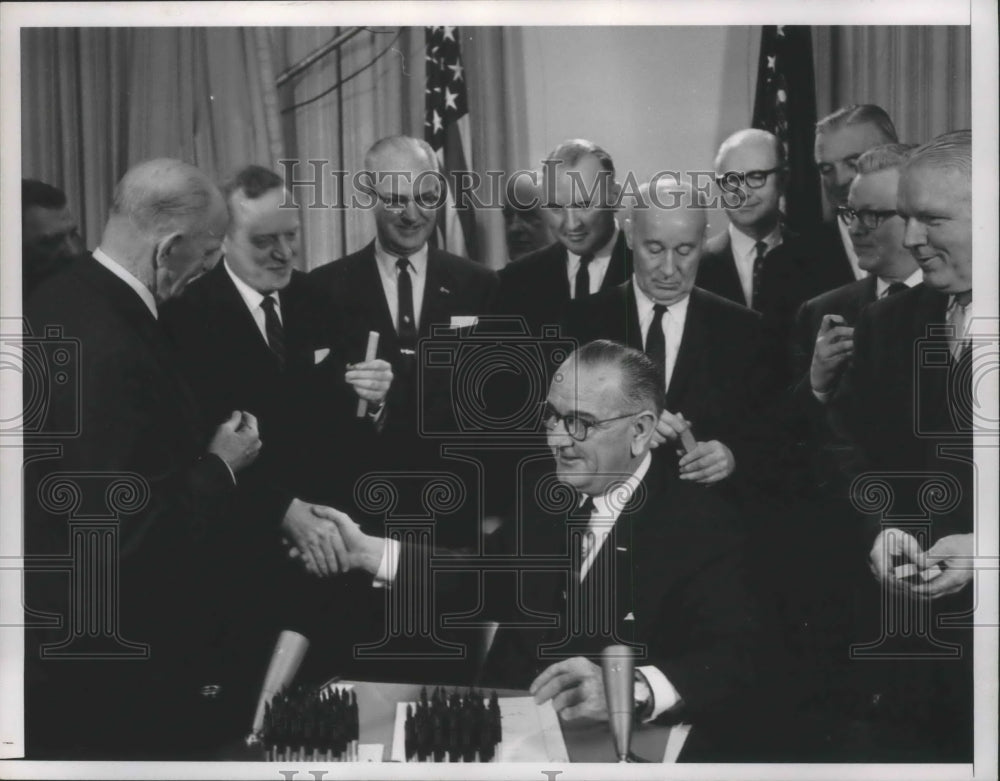 1964, President Johnson signs bill with House Armed Services Comm - Historic Images