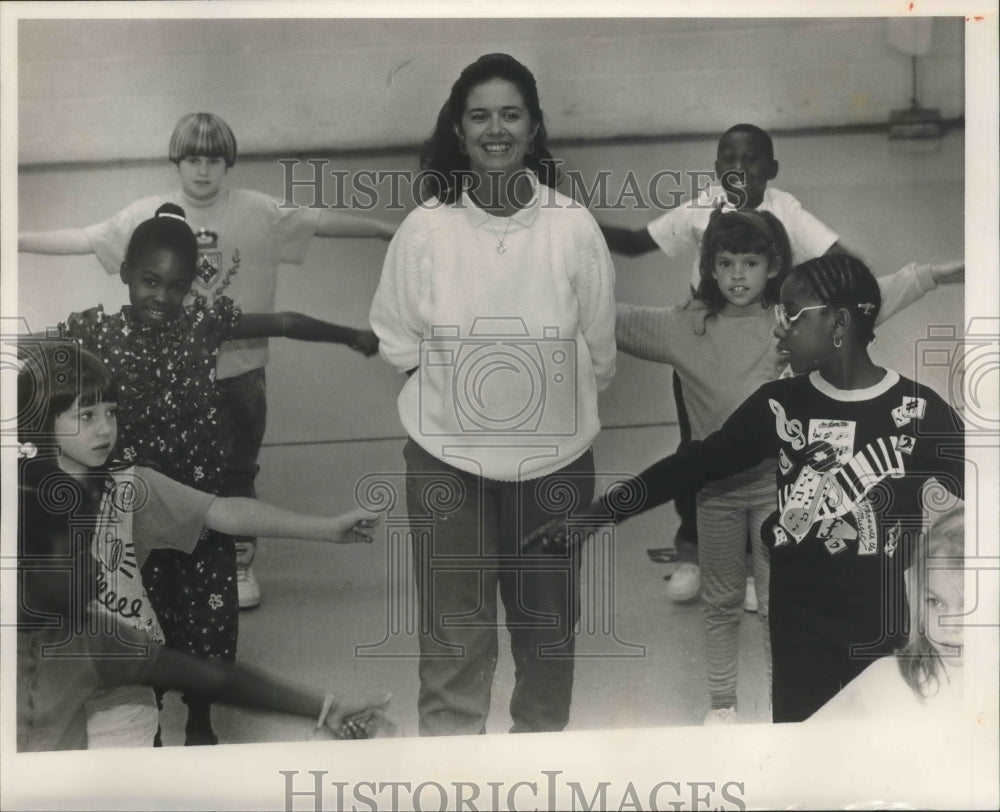 1990 Physical Education teacher Judy Meadows with students, Midfield - Historic Images