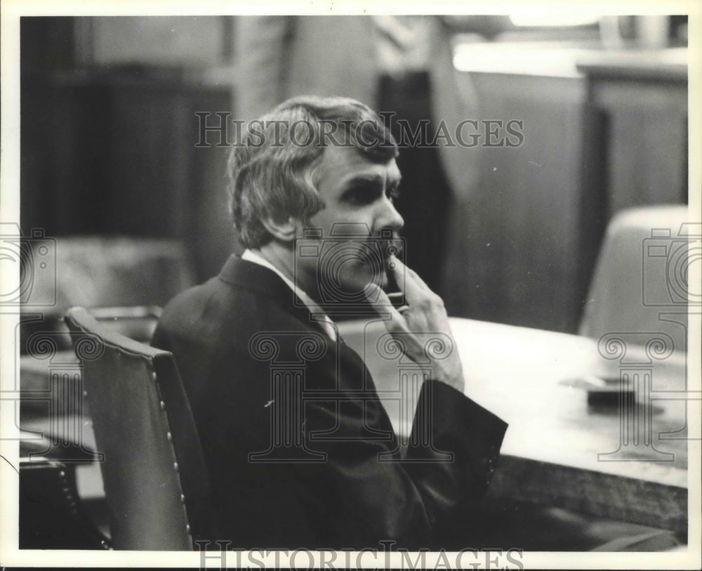 1980 John Milliot, Seated, Listens to Speaker - Historic Images